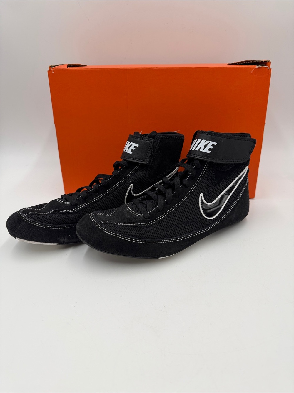 Nike Speedsweep VII wrestling shoes in black and white.